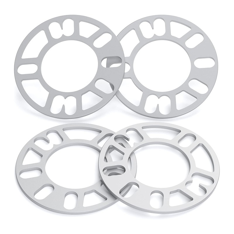 Multi-pattern hub-centric spacer with a separate dark center insert