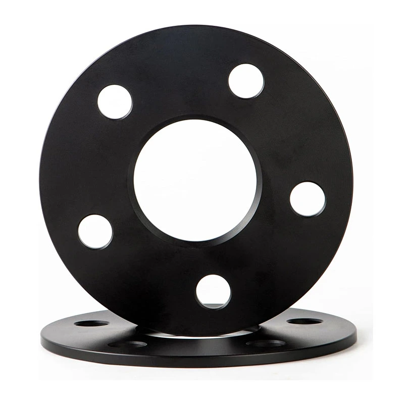Black slip-on wheel spacers showing the center openings and flat wheel-contact faces