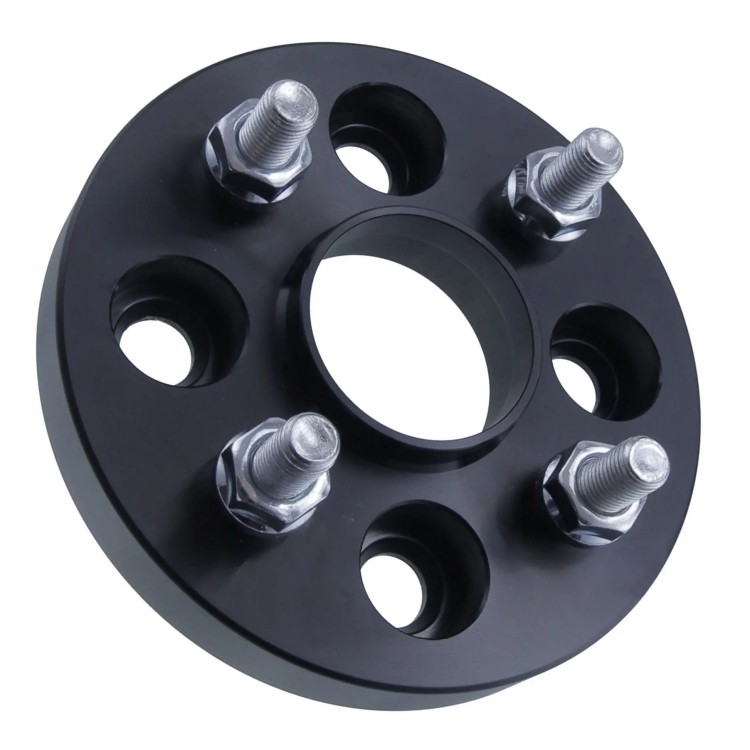 Black four-lug wheel spacer adapter with raised center lip and studs