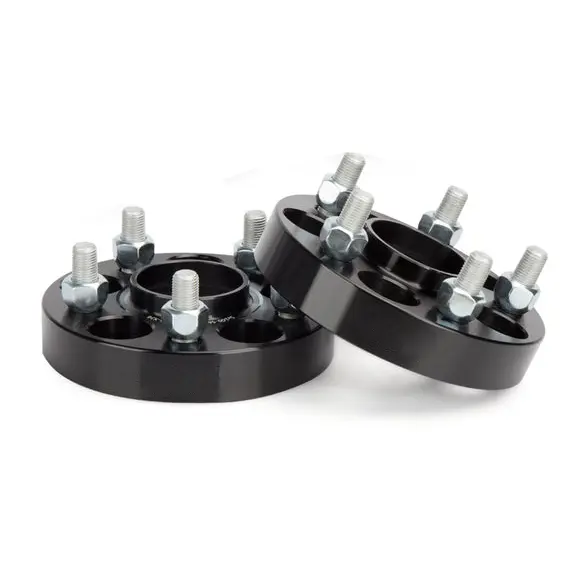 Three black five-lug wheel spacer adapters with installed studs and nuts