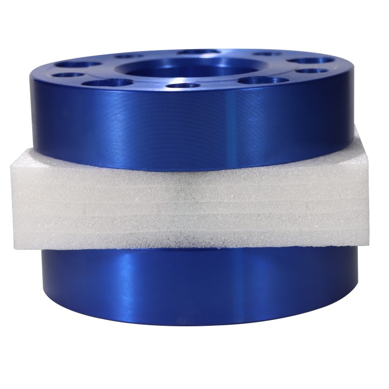 Blue wheel spacer adapter viewed from the side to show its thickness and center lip