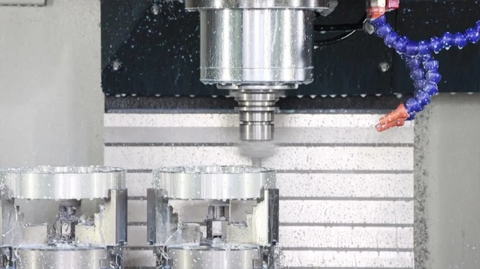 CNC machining center producing circular wheel spacer components