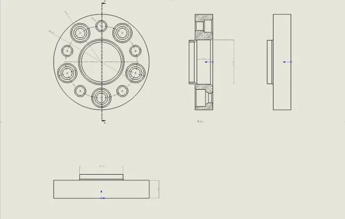 Technical drawing with front and section views of a wheel spacer adapter